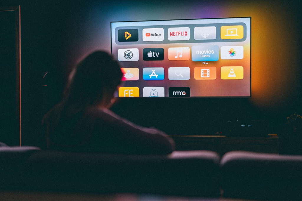 TV showing multiple apps while calculating the cost of every streaming service for full access.