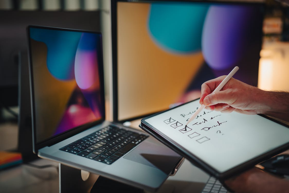 Person checking a digital list while managing the one-in-one-out rule subscriptions strategy.