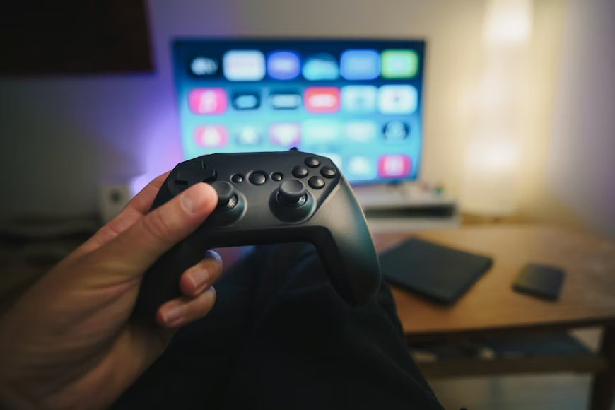 Gaming console for streaming setup with controller and TV apps for home entertainment.