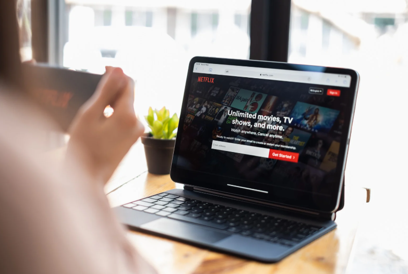 Viewer comparing Netflix premium streaming tiers on a laptop